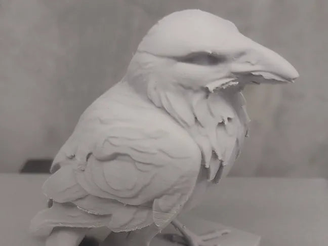 Raven statue perched bird decor